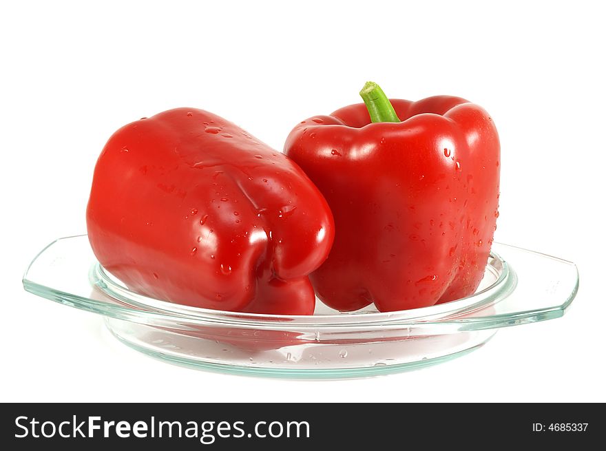 Red pepper and leaves of salad isolated on a white background