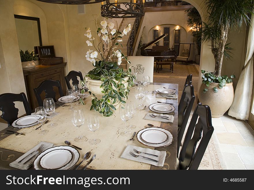 Festive dining table with luxurious dinnerware and decor. Festive dining table with luxurious dinnerware and decor.