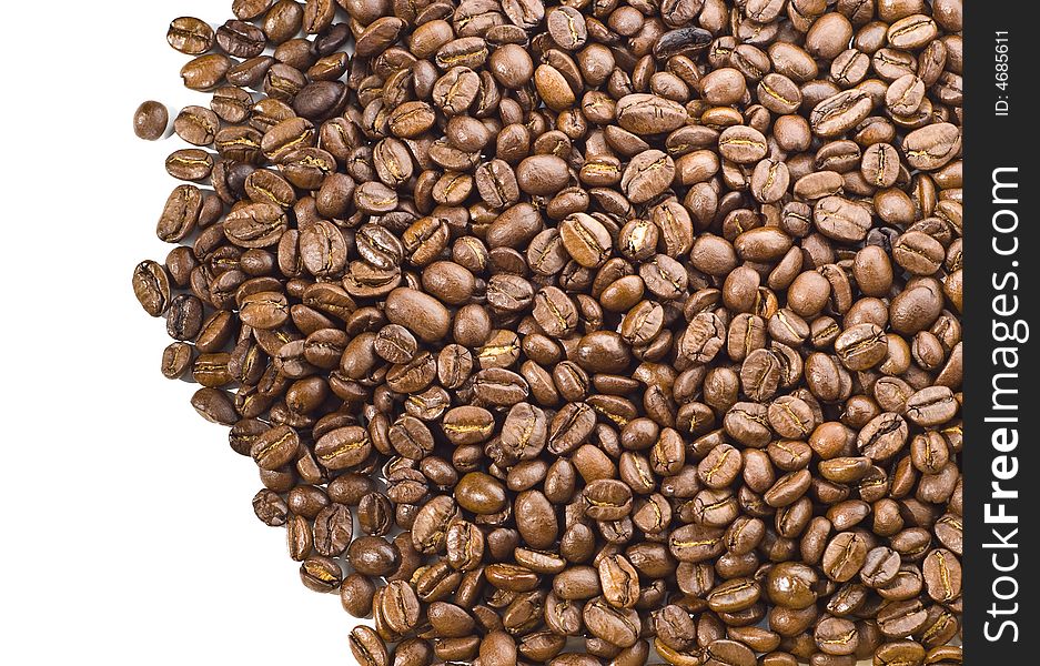 Pile of coffee beans spilled over white background. Pile of coffee beans spilled over white background