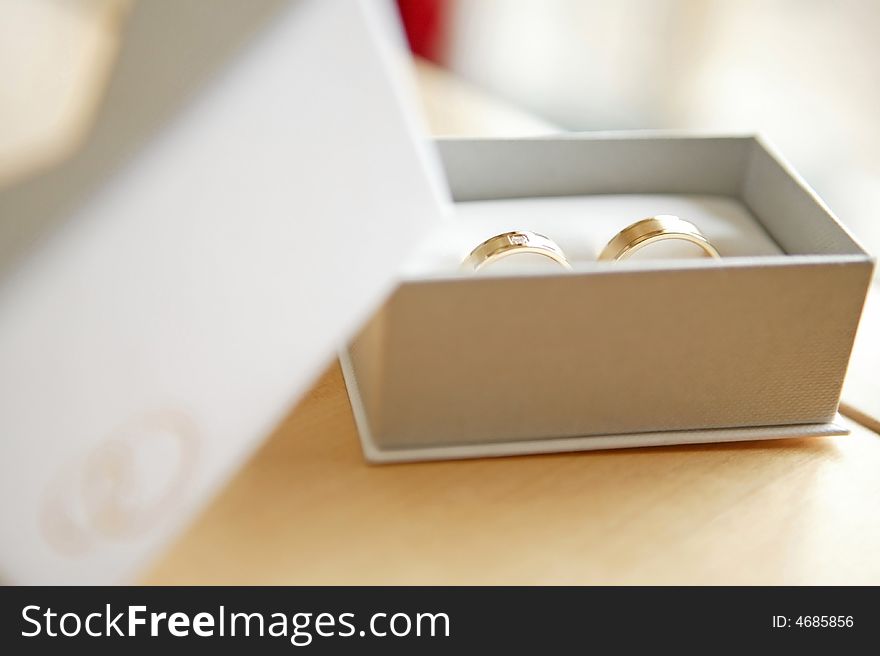 Married ring in a box on a table with blur background