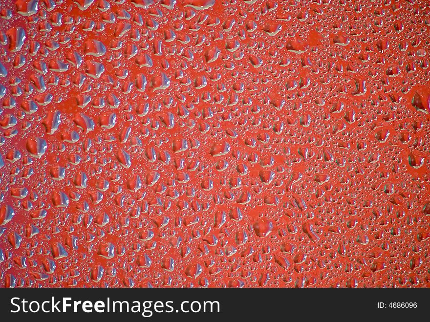 Water drops on the red background
