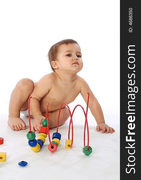 Boy Sitting Near Multicolored Cubes And Curl