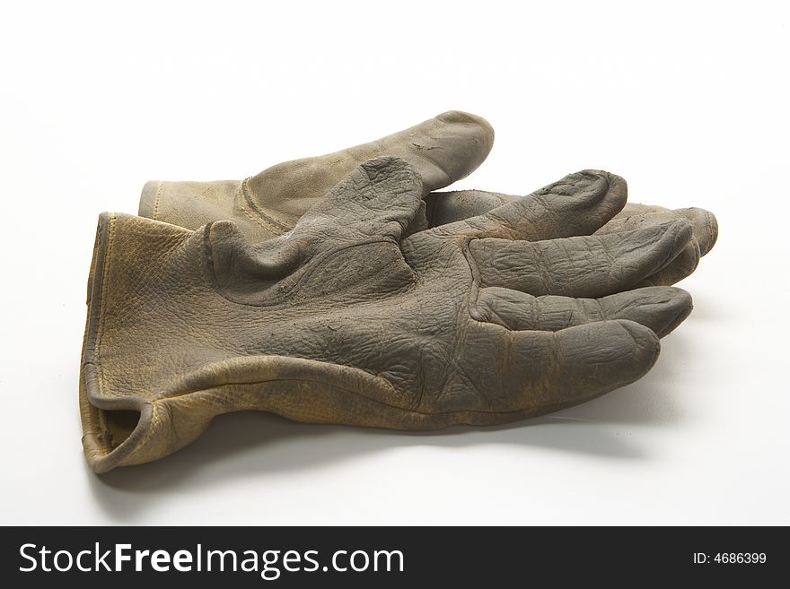 Image of two right gloves or a pair of gloves.  These gloves are  calf skin work gloves used for gardening and other outside labor.  It is viewed from the side. Image of two right gloves or a pair of gloves.  These gloves are  calf skin work gloves used for gardening and other outside labor.  It is viewed from the side.