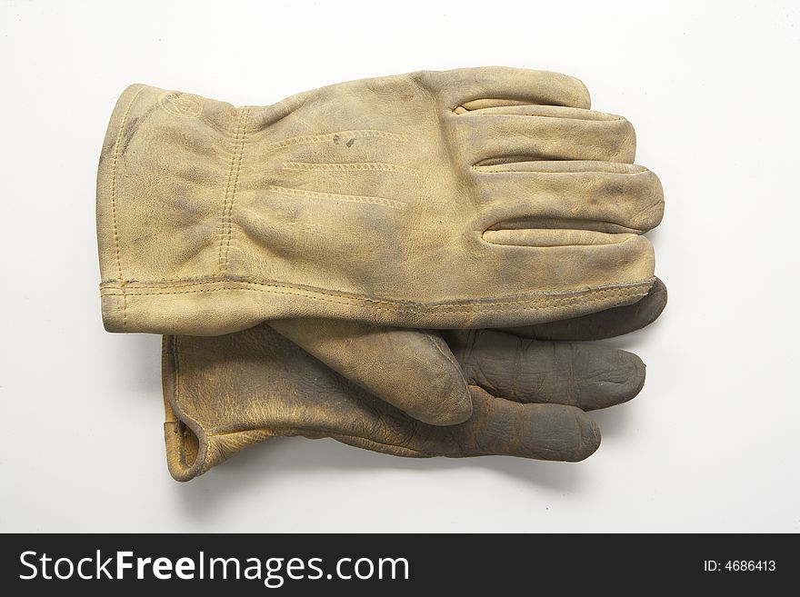Image of a pair of right gloves without the left glove.  These are calf skin work gloves used for gardening and other outside labor.  Ine glove is on top of the other palm facing each other.  They are viewed from overhead. Image of a pair of right gloves without the left glove.  These are calf skin work gloves used for gardening and other outside labor.  Ine glove is on top of the other palm facing each other.  They are viewed from overhead.