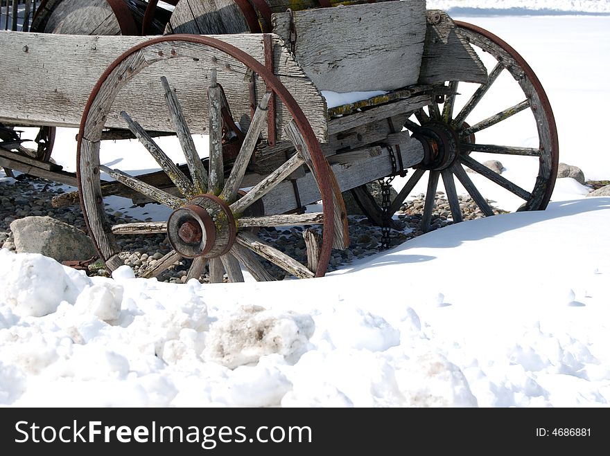 Old wagon buried in the deep snow. Old wagon buried in the deep snow.