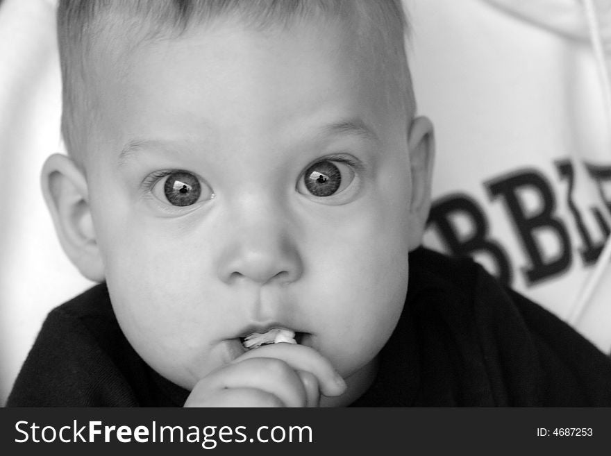 8 month old baby boy with beautiful big eyes. 8 month old baby boy with beautiful big eyes.