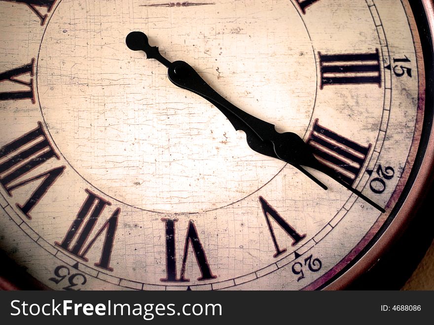 Detail of clock face with numbers and hands showing time. Detail of clock face with numbers and hands showing time