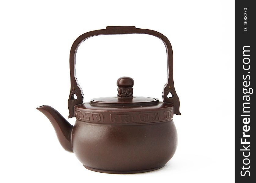 Clay teapot,also called zisha teapot in China,also it is a artwork. isolated on white background. Clay teapot,also called zisha teapot in China,also it is a artwork. isolated on white background.