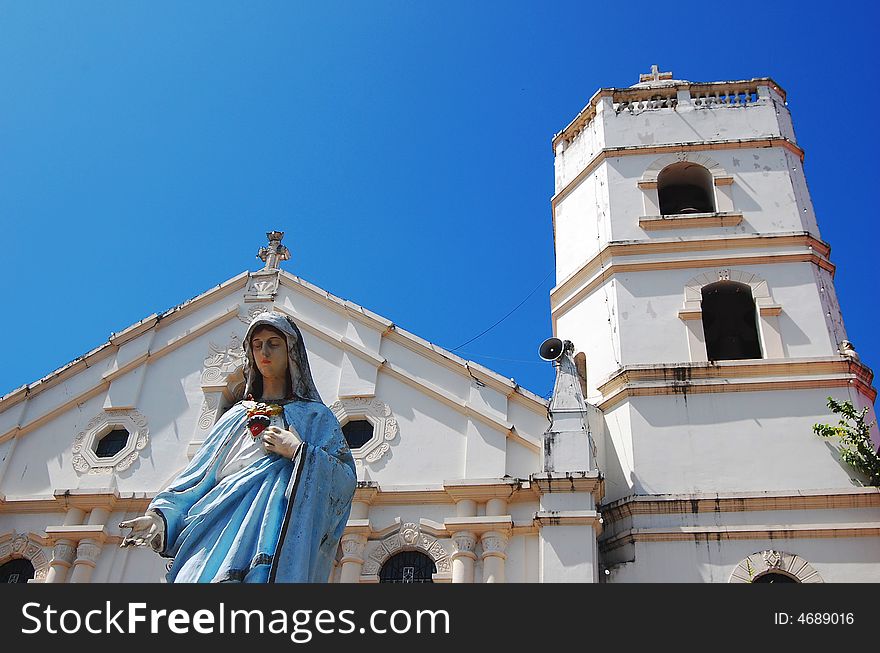 Virgin mary with church background