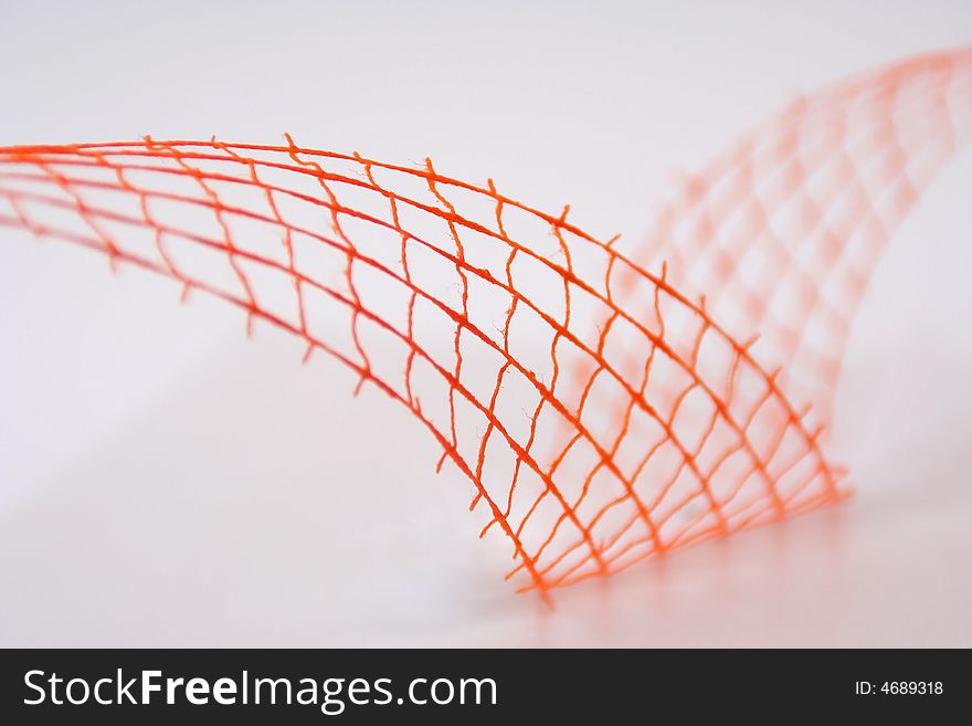 Closeup of orange wavy decoration (net, wire). Closeup of orange wavy decoration (net, wire)