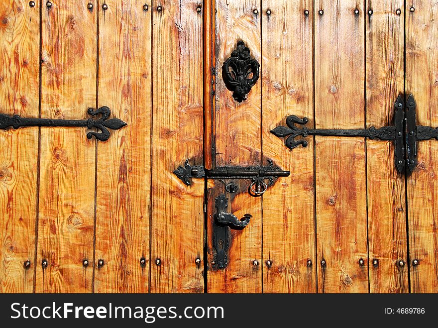 Wooden door with metallic patterns. Wooden door with metallic patterns