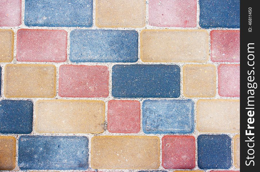 Colored background and texture from paving slabs outside