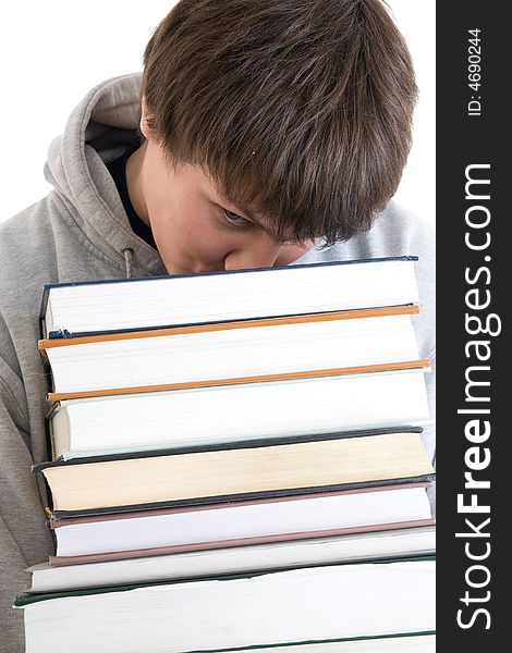 The young student with a pile of books isolated on a white background