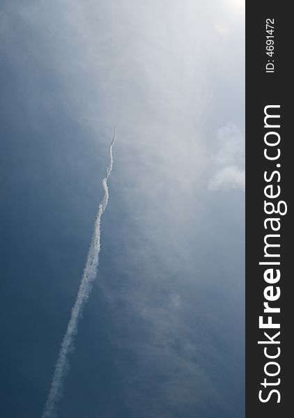 Smoke trial from fighter jet flying up into the sky. Smoke trial from fighter jet flying up into the sky