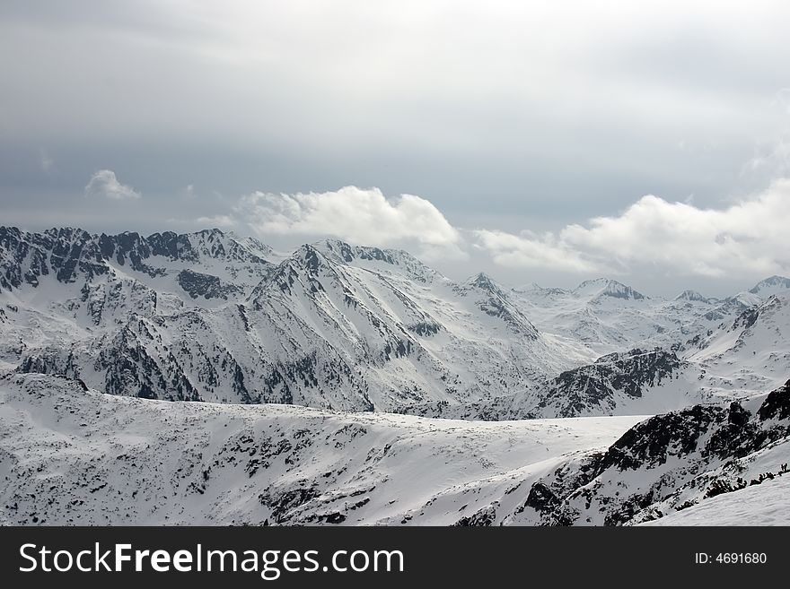 Peaks with clouds and sky in Pirin mountains. Peaks with clouds and sky in Pirin mountains