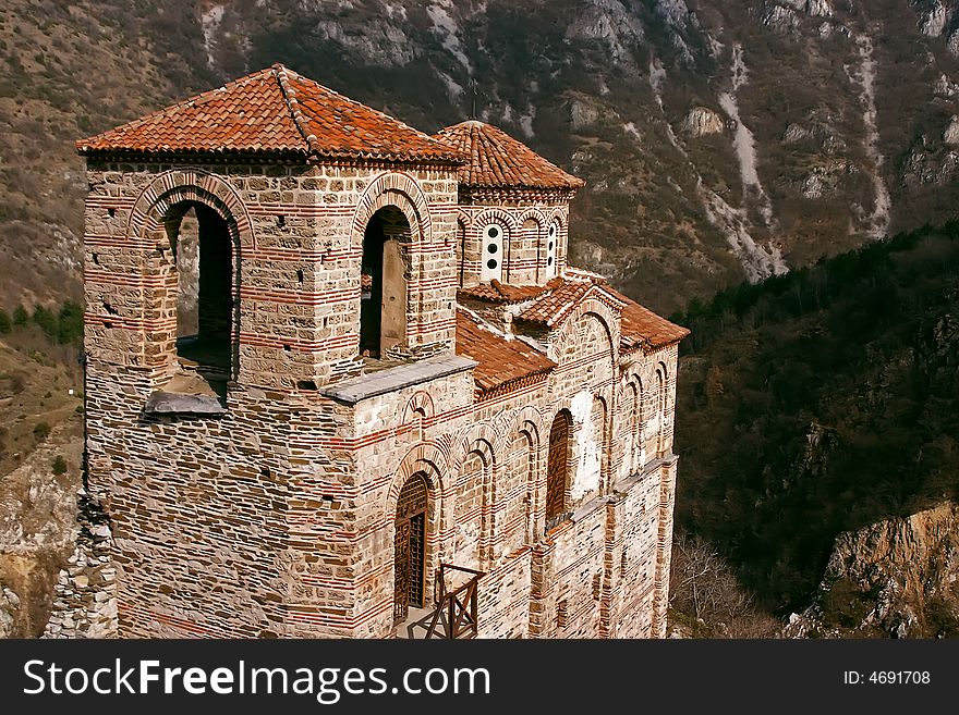 Old antique ortodox church in mountains with trees. Old antique ortodox church in mountains with trees
