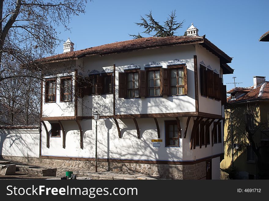 Bulgarian old antique house with tree and sky. Bulgarian old antique house with tree and sky