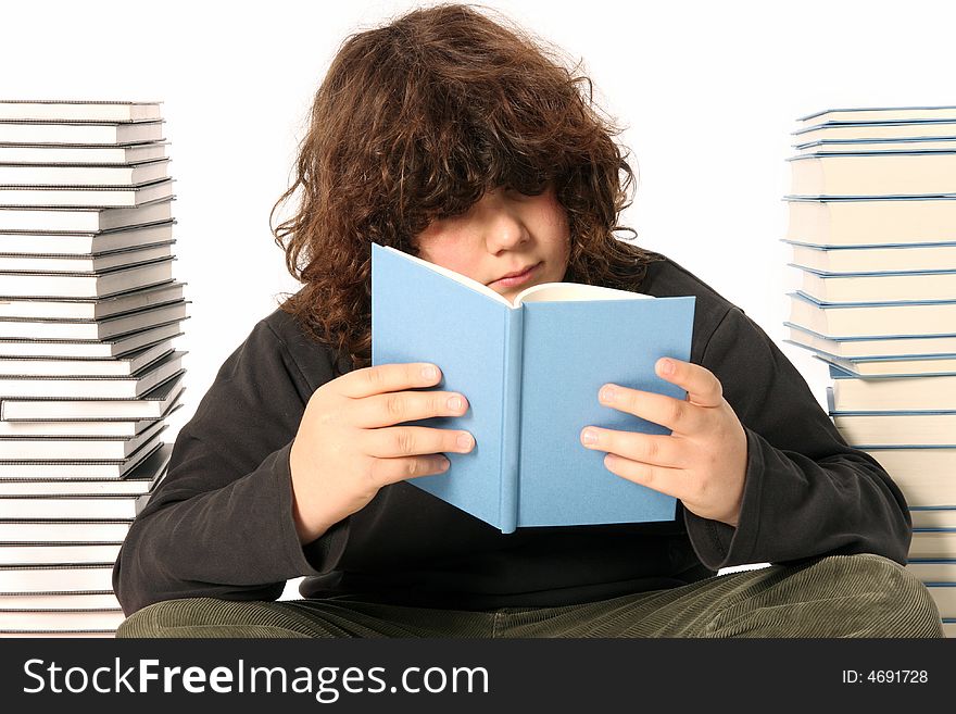 Boy reading a book and many books on white background