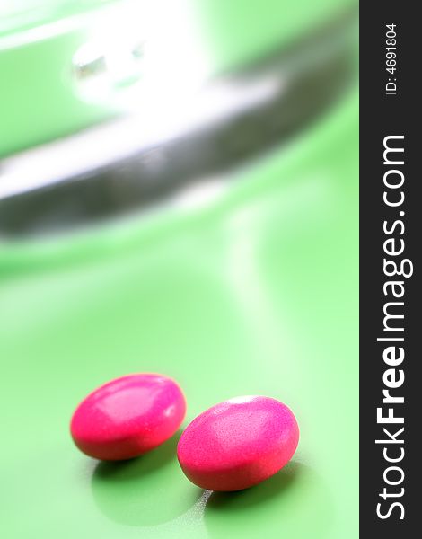 Pink Pills On Green