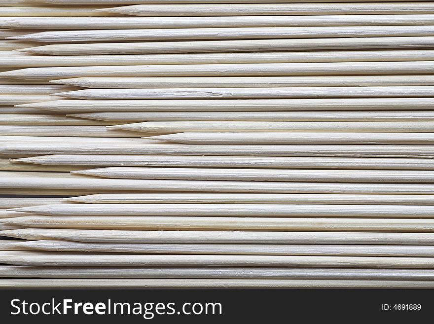 Detail of some sharpened bamboo food skewers. Detail of some sharpened bamboo food skewers.