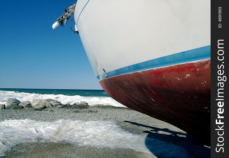 A large sailboat waiting for winter to come to an end. A large sailboat waiting for winter to come to an end.