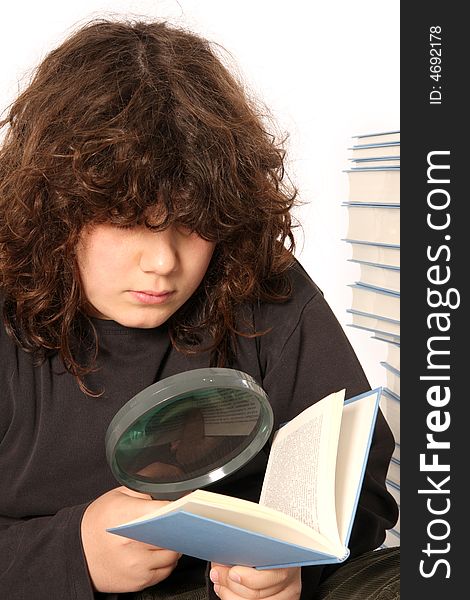 Boy Reading A Book With Lens