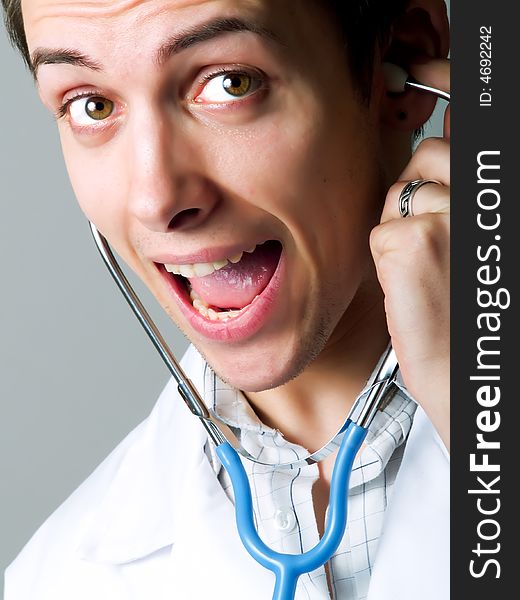 Happy young doctor with a stethoscope