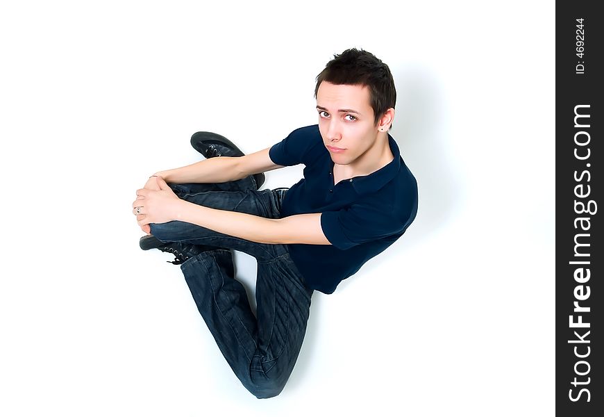 Happy young man posing on a white background
