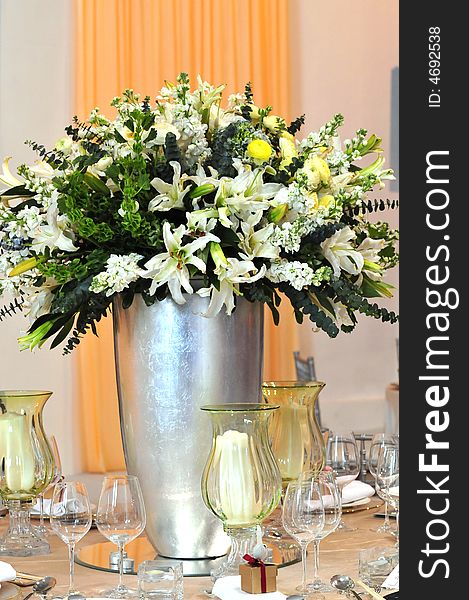 White flower  lily bottle glass table. White flower  lily bottle glass table