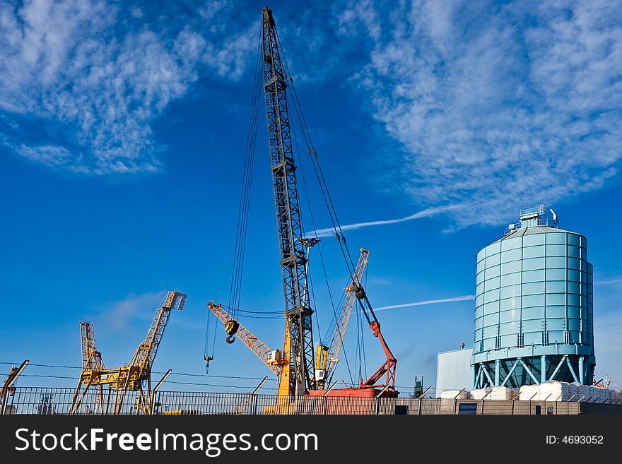 Cranes in a building area near Piombino Harbour, Tuscany, Italy.