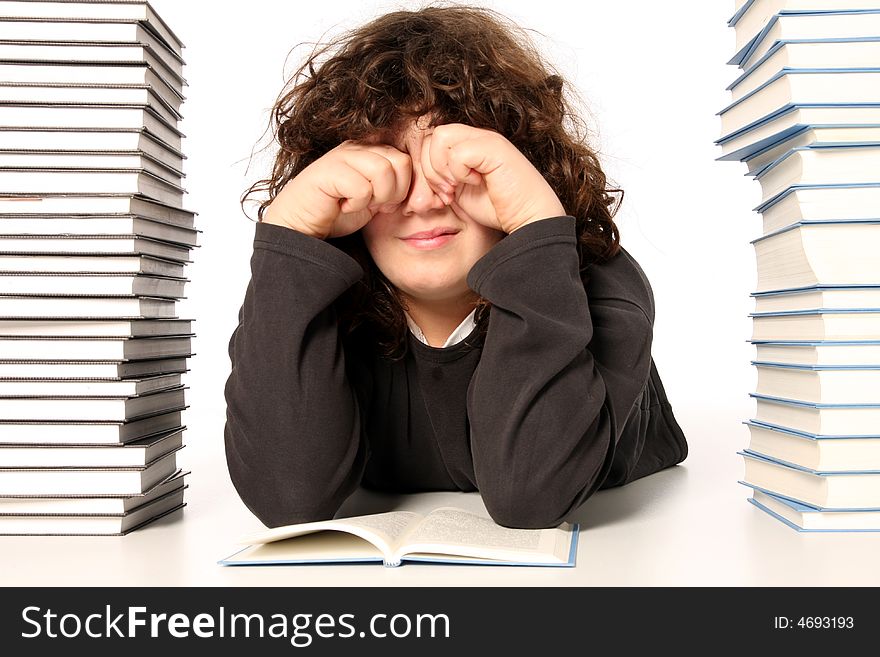 Boy crying and and many books on white background