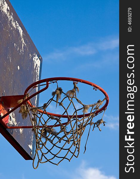 Single basketball construction with hoop and net outdoor macro