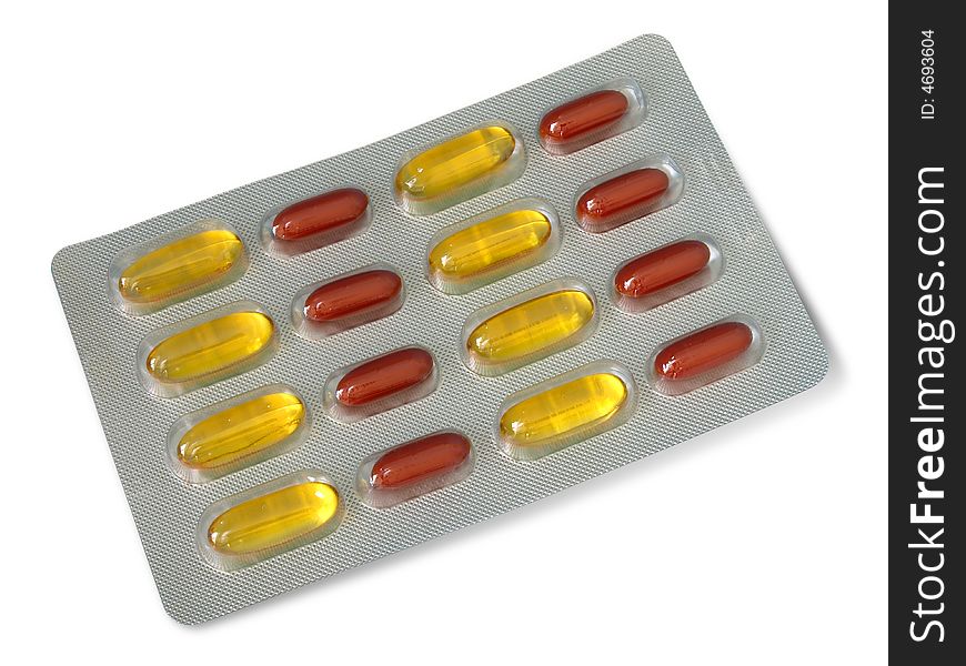 Pack of red and yellow vitamin pills isolated over white background. Pack of red and yellow vitamin pills isolated over white background