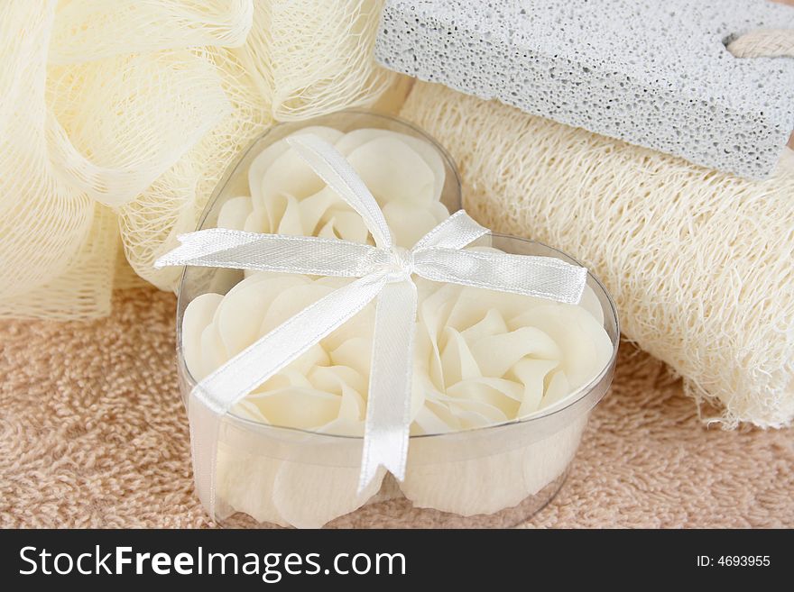 White soap flowers in heart box and bath sponges. White soap flowers in heart box and bath sponges