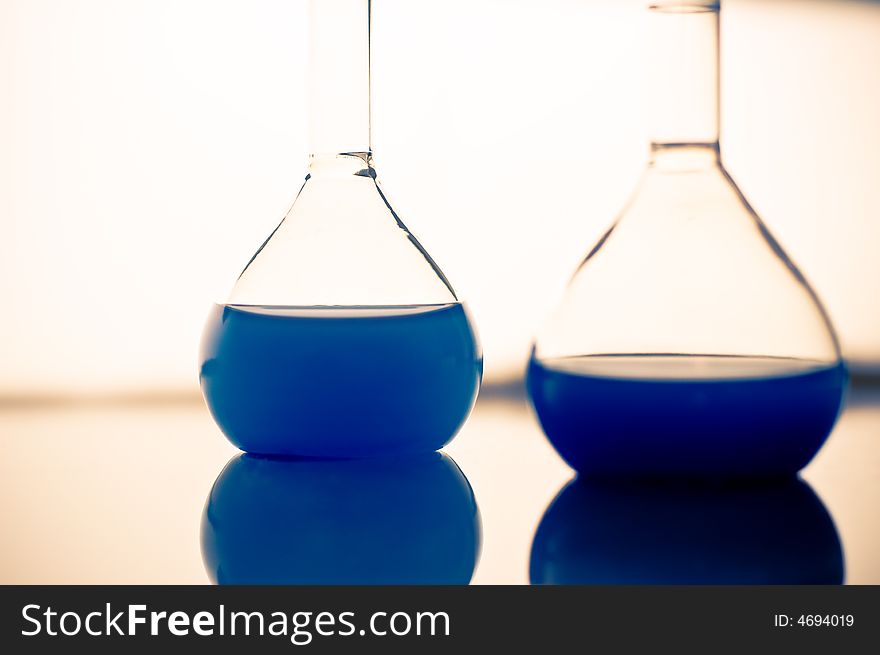 Laboratory beakers with blue liquid