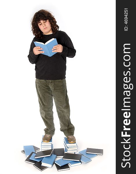 Boy on stack of books on white background