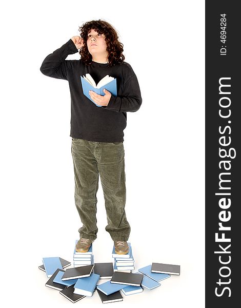 Boy on stack of books on white background