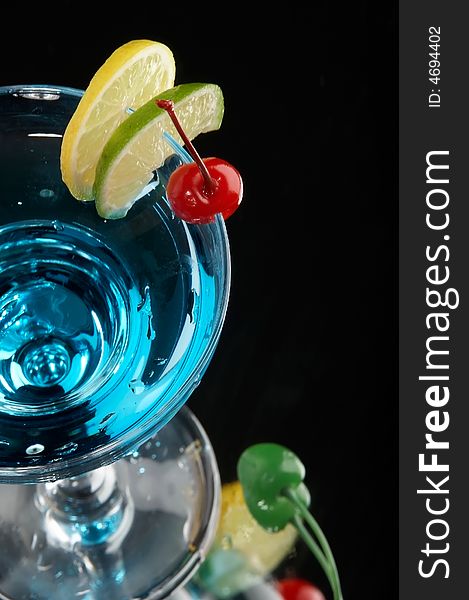 Still life with glass with drink on the black background