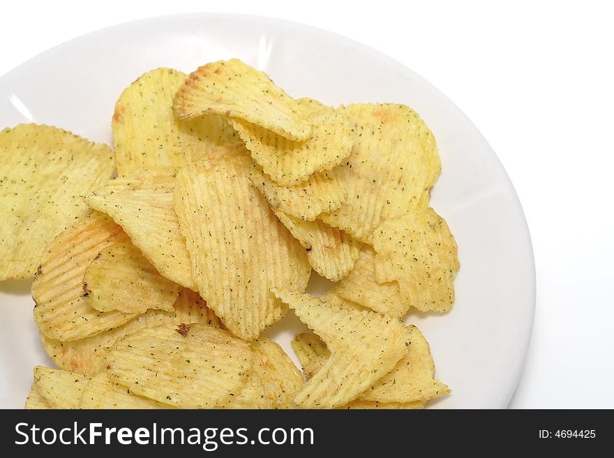 A lot of chips on a plate. Top view
