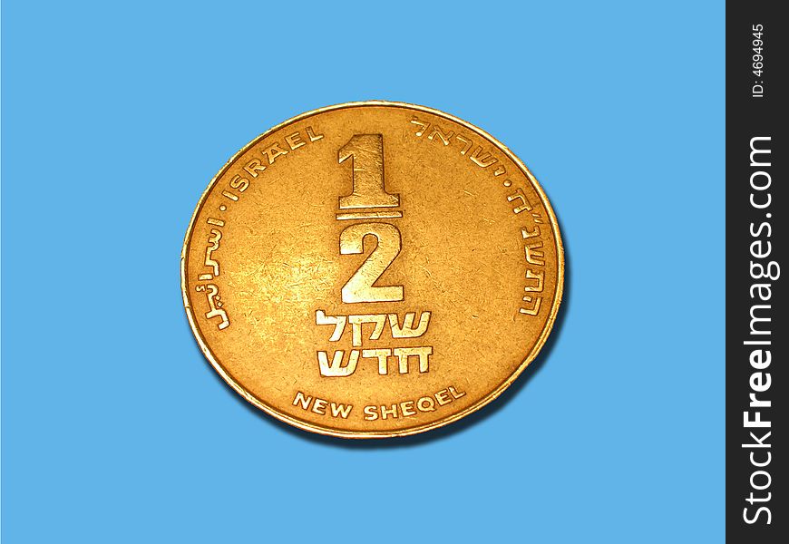 Coin of Israel new sheqel isolated on blue background. Coin of Israel new sheqel isolated on blue background