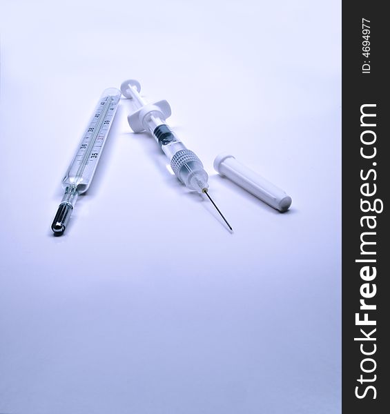 Medical thermometer and syringe