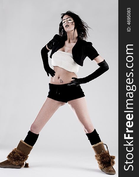 Young brunette in extreme high fashion pose. Young brunette in extreme high fashion pose