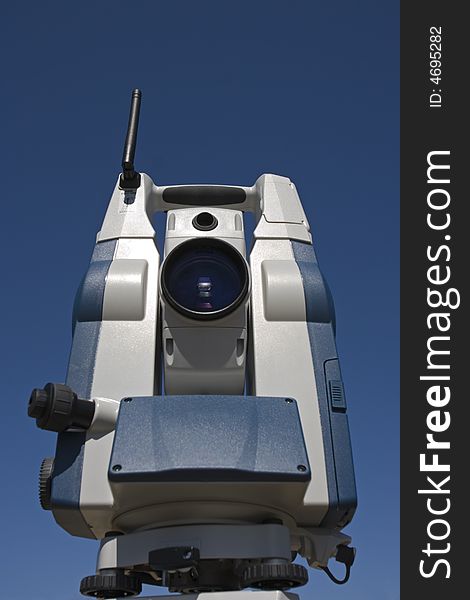 Theodolite with blue sky as a background.