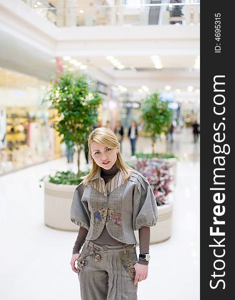 Pretty girl posing in a modern mall. Pretty girl posing in a modern mall