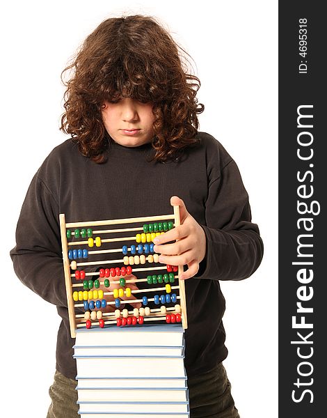 Boy with abacus calculator with colored beads and books