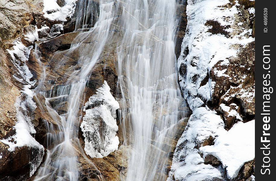 Mountain frozen waterfall, winter season, horizontal orientation