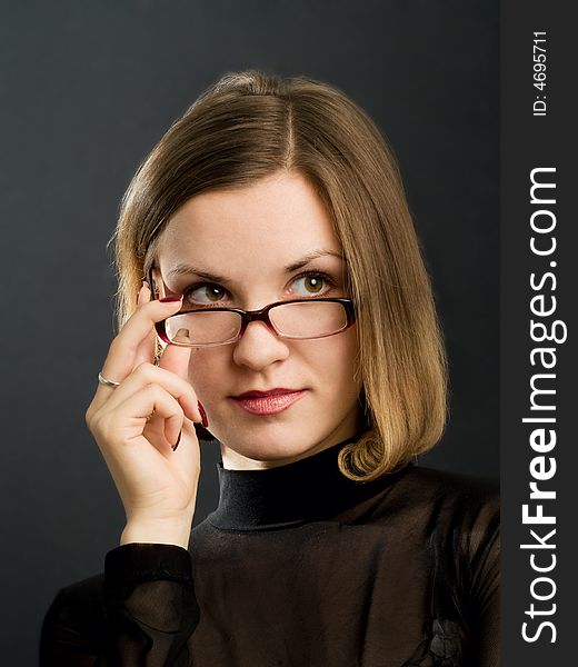 Portrait of girl with hand near glasses. Portrait of girl with hand near glasses