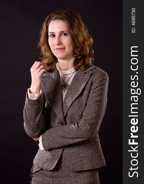 Portrait of smiling businesswoman on black