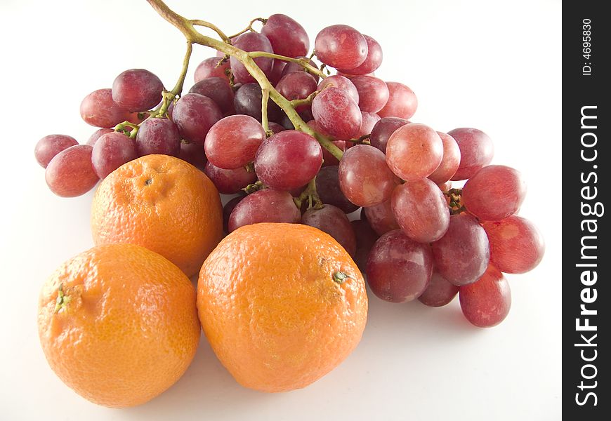 Grapes and mandarines isolated on white background. Grapes and mandarines isolated on white background