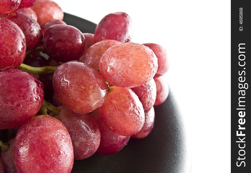 Fresh red grapes isolated on white background